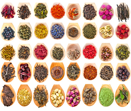 Collection Set of Tea Leaves and Fruit Berry Flower Additives in spoon scoop, isolated on white backgroundの写真素材