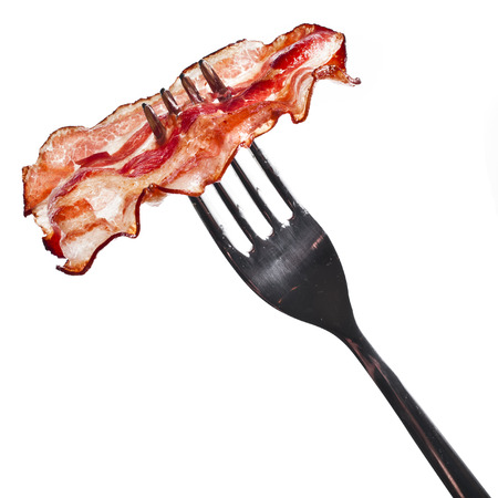 Bacon Fried Crisp Slice on Fork isolated On White Backgroundの写真素材