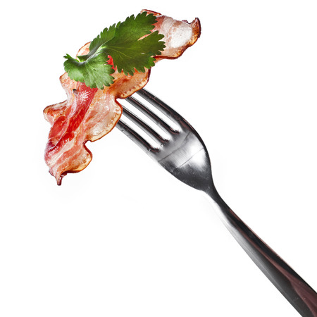 Bacon Fried Crisp Slice on Fork isolated On White Backgroundの写真素材