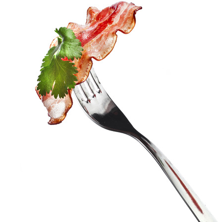 Bacon Fried Crisp Slice on Fork isolated On White Backgroundの写真素材