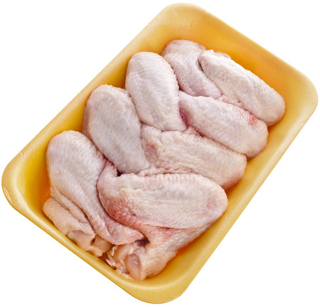 Raw Chicken Wings in a Package Close up Top View Surface Isolated On White Backgroundの写真素材