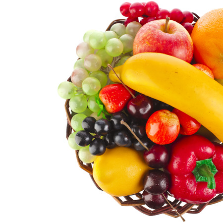 tasty summer fruits in basket top view surface isolated on whiteの写真素材
