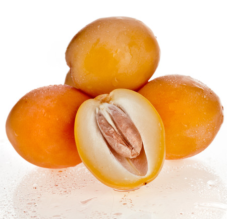 Fresh date fruits close up isolated on white backgroundの写真素材