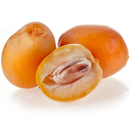 Fresh date fruits close up isolated on white backgroundの写真素材
