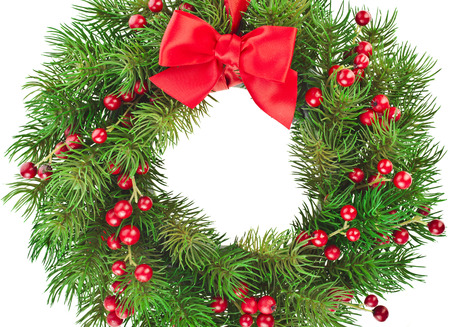 Christmas decoration wreath with red holly berries close up isolated on white backgroundの写真素材