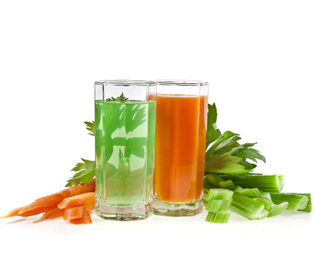 Celery and carrot juice isolated on white backgroundの写真素材