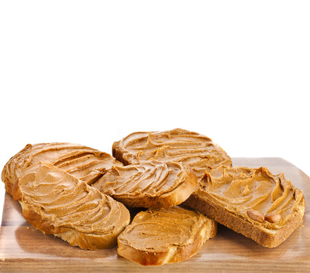 peanut butter sandwich and peanuts isolated on white backgroundの写真素材