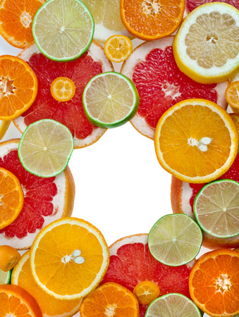 frame of slices citrus top view colorful surface isolated on white backgroundの写真素材