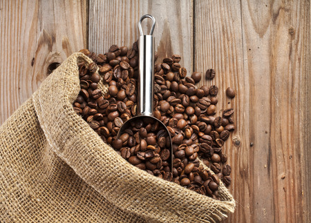Coffee beans on grunge wooden backgroundの写真素材