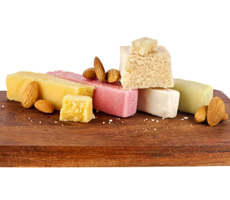Marzipan with almonds on wooden boardの写真素材