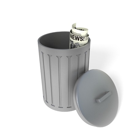 Metal trash bin or can with an newspaperの写真素材