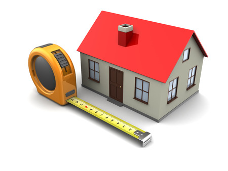 3d illustration of tape meter and house model, over white backgroundの写真素材
