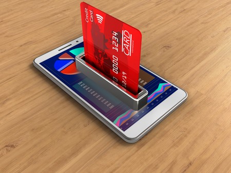 3d illustration of white phone over wooden background with bank cardの写真素材