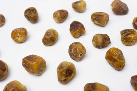 row of dates palm fruit on a white background, Infinite depth of field, retouchedの写真素材