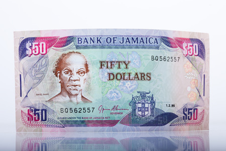 jamaican $ 50 bill, white background, reflection,の写真素材