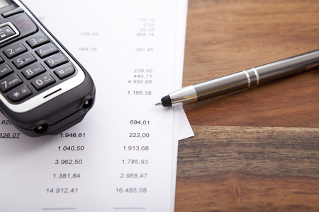 printout on wooden office desk with numbers, copy spaceの写真素材