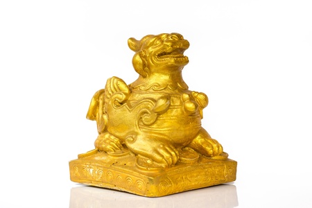 gold chinese lion isolated in white backgroundの写真素材