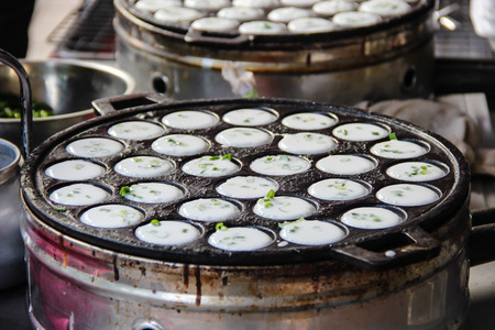 kind of Thai sweetmeat  Coconut milk mix with powder fried dessert