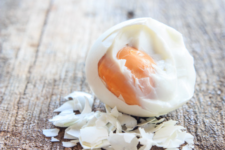 boiled egg on wooden boardの写真素材