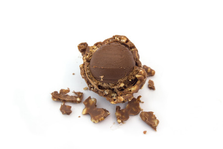 cookie chocolate with a bite and crumb isolated on white backgroundの写真素材