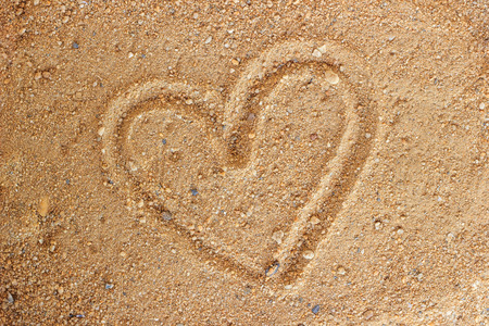 Heart drawn on sand, vintageの写真素材