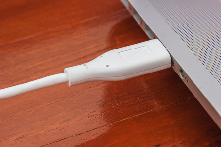 USB cable connecting in to laptop computer