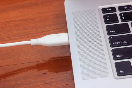 USB cable connecting in to laptop computer