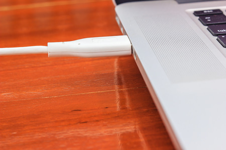 USB cable connecting in to laptop computer