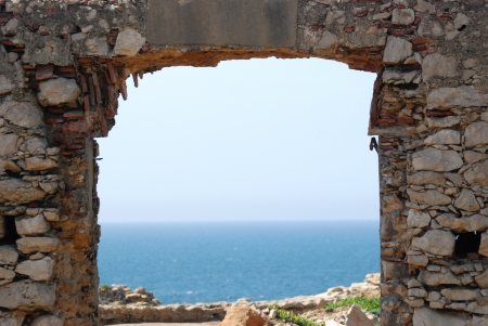 Portic entrance of seaside fort with view over horizonの写真素材