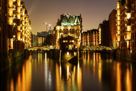 at night in the famous warehouse district in Hamburg, Germanyの写真素材
