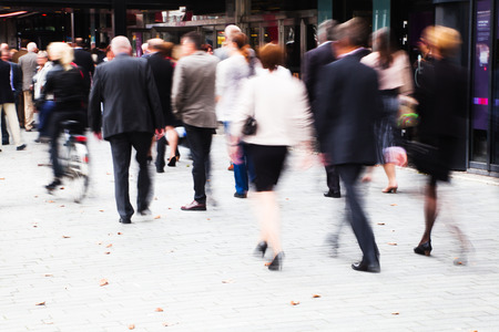 crowd of dressed up people in motion blur walking to a concert