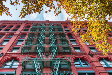 typical old building with fire escape ladders in Soho, Manhattan, New York Cityの写真素材