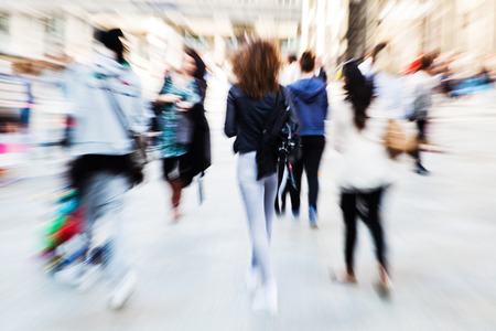 crowd of people shopping in the city with creative zoom effect, made by camera