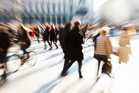 crowds of people in the city with creative zoom effectの写真素材