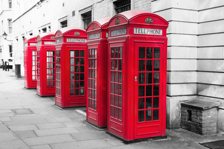 row of traditional phone boxes in London cityの写真素材
