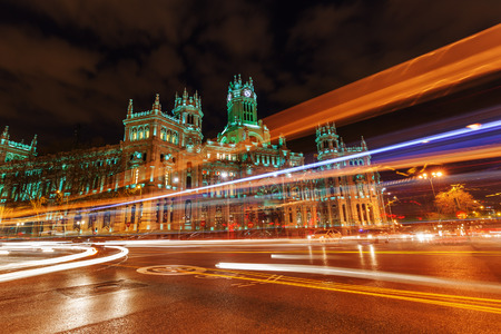 Palacio de Cibeles at the Plaza de Cibeles with light trails of the traffic at night, Madrid, Spainの写真素材