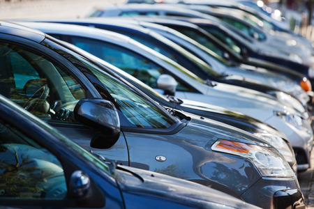 row of cars on a parking lot