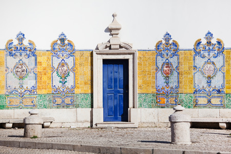 typical old house wall with decorative tiles in Lisbon, Portugalのeditorial素材