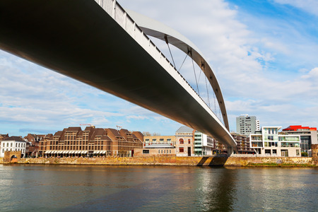Maastricht, Netherlands - April 11, 2016: modern bridge over the river Meuse in Maastricht. Maastricht is a university city and the capital of the Dutch province Limburgのeditorial素材
