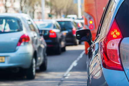 rows of cars in a traffic jam with small depth of field