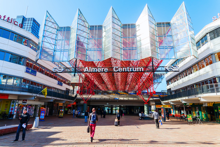 Almere, Netherlands - April 19, 2016: railway station of Almere with unidentified people. Almere is a fast growing, planned city. With a population of about 200,000 it is the 7th largest Dutch cityのeditorial素材