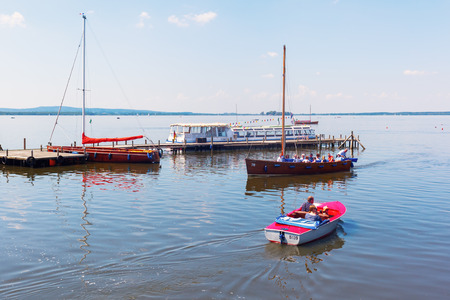 Steinhude, Germany - June 05, 2016: Steinhuder Meer at Steinhude with unidentified people. With about 30 sq km it is the largest lake of northwestern Germany and it is a nationwide tourist destinationのeditorial素材