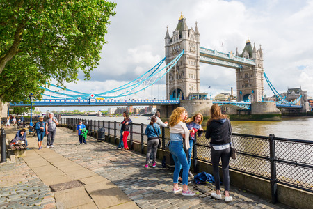 London, UK - June 15, 2016: Tower Bridge in London with unidentified people. The Tower Bridge spanning the river Thames is a combined bascule and suspension bridge in London built in 1886のeditorial素材