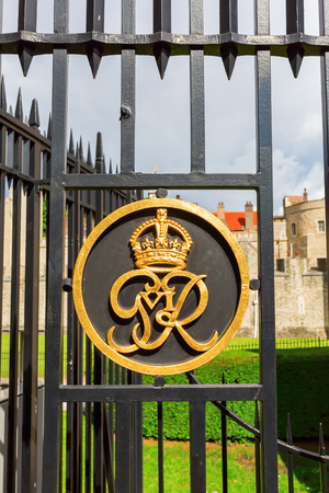London, UK - June 15, 2016: golden emblem at the fence of the Tower of London. Today the Tower of London is one of the country's most popular tourist attractions and is protected as a World Heritage Site.のeditorial素材
