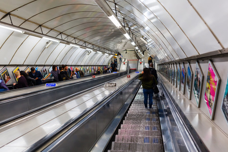 London, UK - June 19, 2016: unidentified busy commuters on elevators of an underground station in...