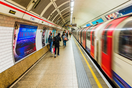 London, UK - June 19, 2016: platform of an underground station with unidentified people in London. The London Underground is the oldest underground of the world.のeditorial素材