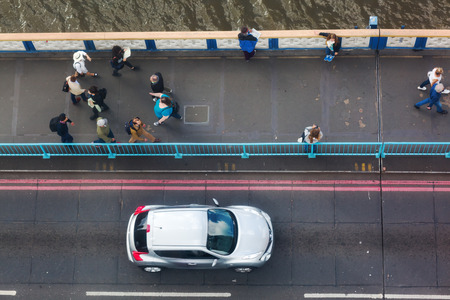 London, UK - June 15, 2016: view from high-level walkway of Tower Bridge on the bridge traffic. The...