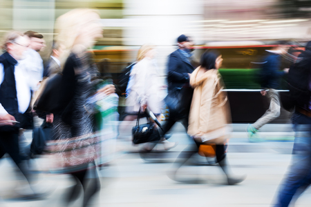 picture in motion blur of walking commuters at rush hourの写真素材