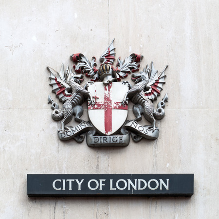 London, UK - June 15, 2016: coat of arms of the City of London. It is the official coat of arms of the City of London, which is one of a number of cities and boroughs in Greater London.のeditorial素材