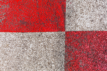 background picture of asphalt with geometric painted red and white colorの写真素材